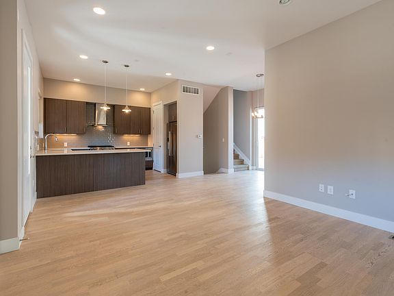 Cozy living room/dining room and kitchen bar.