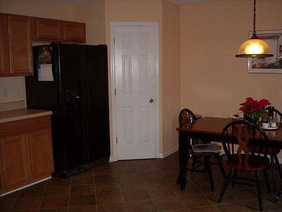Another view of the kitchen. Breakfast area with generously sized pantry!
