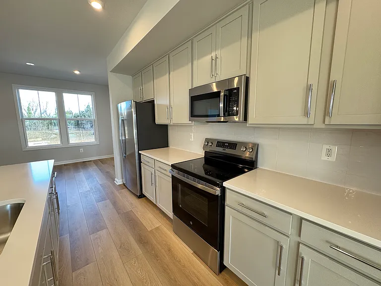 Electric Stove, Microwave, Cabinets