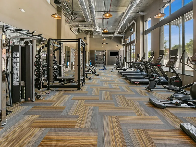 Stay active with top-tier cardio machines and strength training equipment, all in a bright and modern setting.