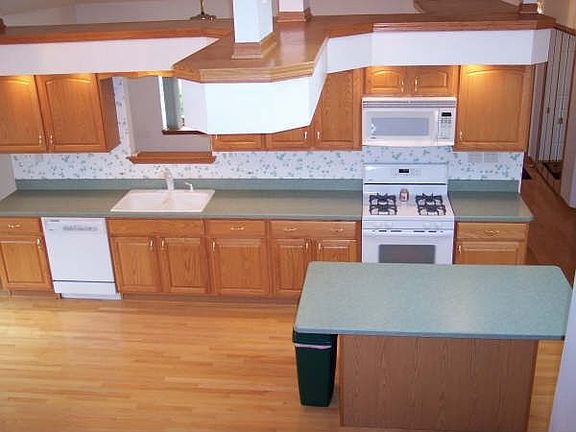 Vaulted Ceilings in the Kitchen. Island has room for (3) stools.