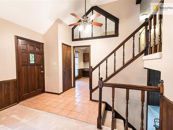 Unique layout with lots of openings in the architecture and beautifully maintained dark woodwork.