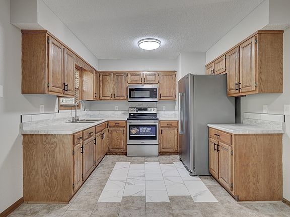 Clean and bright kitchen with new appliances including an oven with an air fryer feature