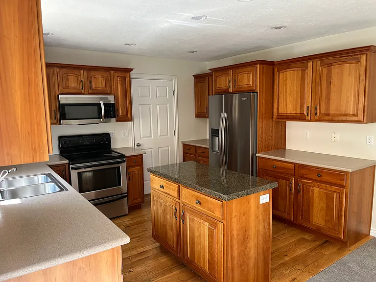 Kitchen, Door leads to the Laundry Room and Garage