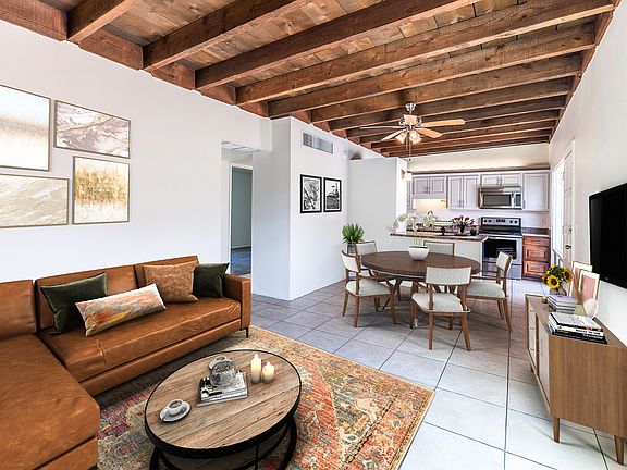 GREAT ROOM WITH STUNNING HIGH RAUGH SAWN WOOD BEAM CEILINGS (STAGED)