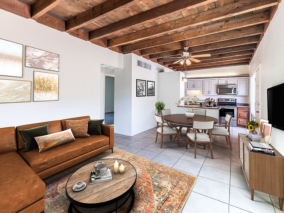 GREAT ROOM WITH STUNNING HIGH RAUGH SAWN WOOD BEAM CEILINGS (STAGED)