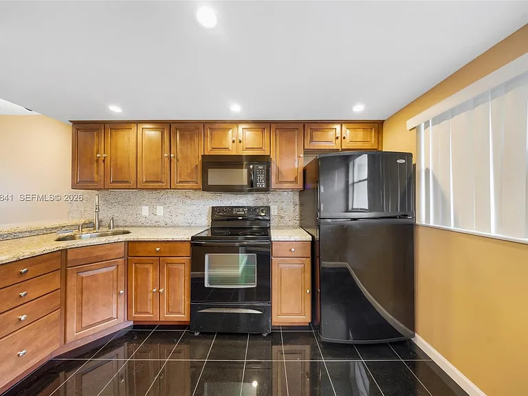 6075 N Sabal Palm Blvd #210 — Photo 1
