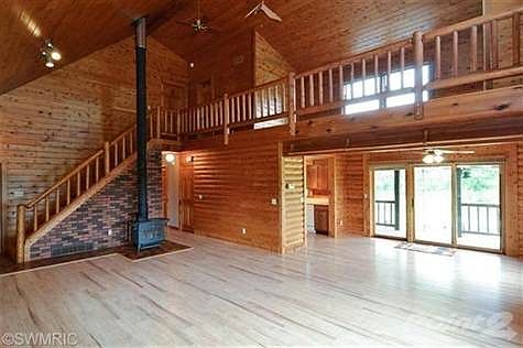 Wide open Floor Plan with Living Room/Great room. Loft area on top with dining area over looking bac