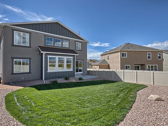 Rear Yard Photo representing home to be built and may demonstrate optional features