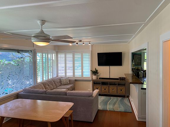 Entering into the Main Living Area. Heat reducing tint and custom-designed privacy laminate on the home's original front window.