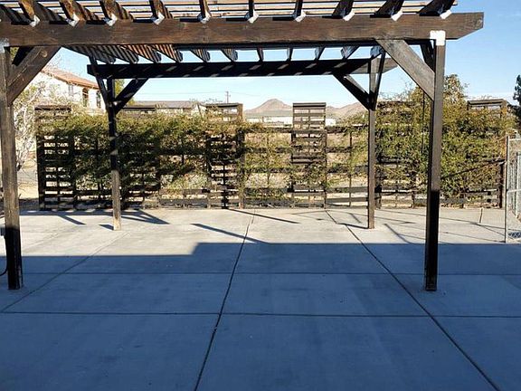 Back yard patio and BBQ area with pergola.