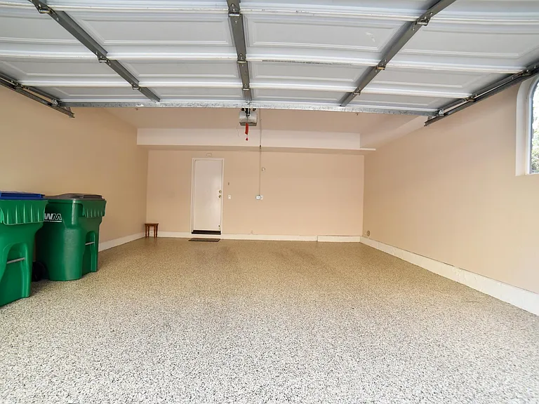 2 car garage with epoxy flooring, indoor access to the condo
