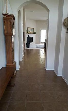 Open the door, nice entry.  Look at all that tile! Office is located immediately to right.