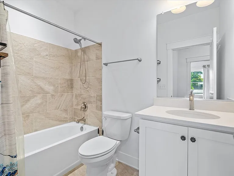 Hall bathroom adjacent to the second and third bedroom