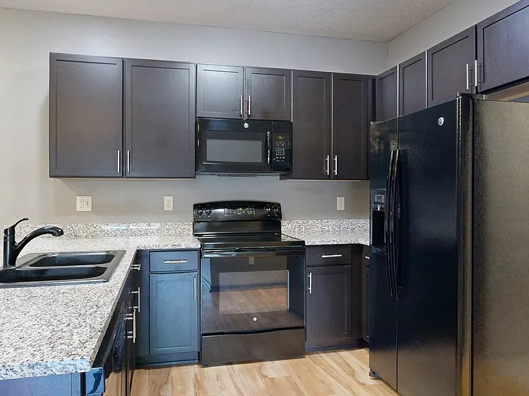 Cook and connect in our modern kitchens with granite countertops, sleek cabinetry, and plenty of room for meal preparation.