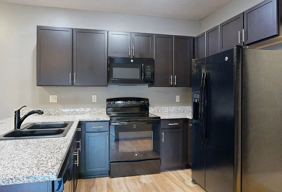 Cook and connect in our modern kitchens with granite countertops, sleek cabinetry, and plenty of room for meal preparation.