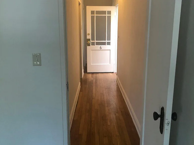 Picture of hallway with front door open