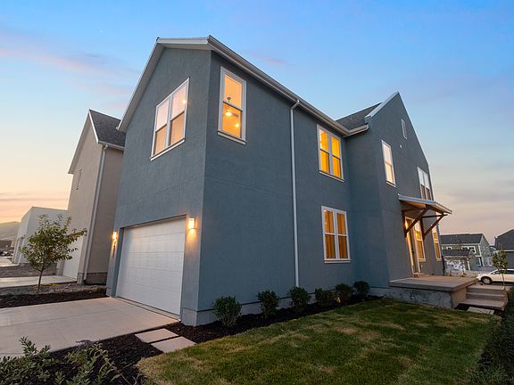 Modern two-story house from the Contempo Collection with a gray exterior, large windows, and a white