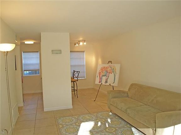 Living area open to kitchen and eating areas