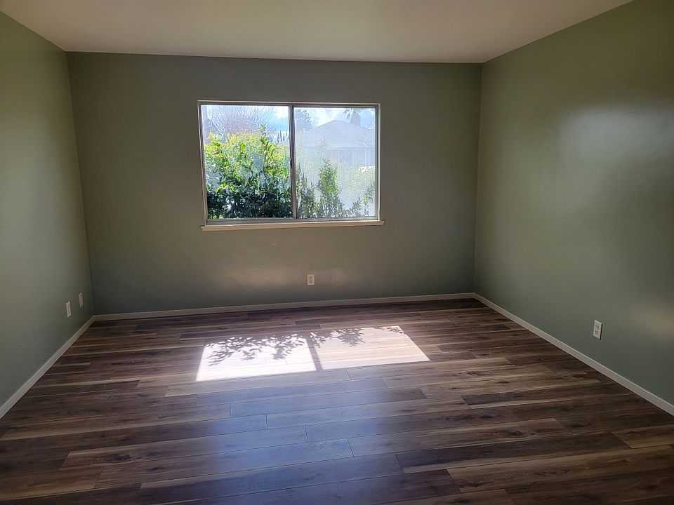 Living room before windows were cleaned and Zebra cordless blinds installed