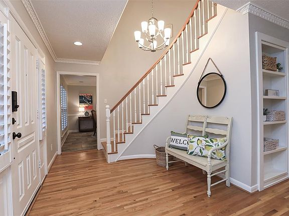 TWO STORY ENTRY WITH NEW CHANDELIER