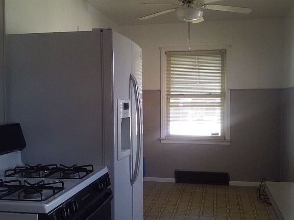 Kitchen with included stove and refrigerator
