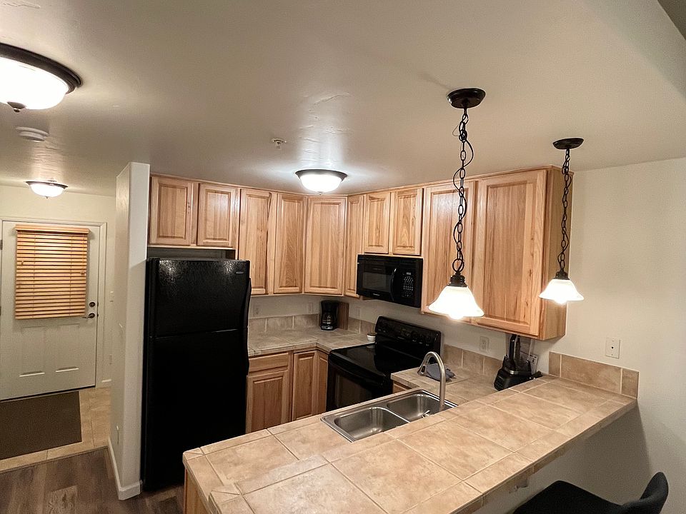 Kitchen with two bar stools.