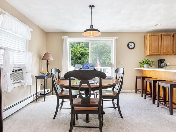 Dining, breakfast bar, and slider to deck