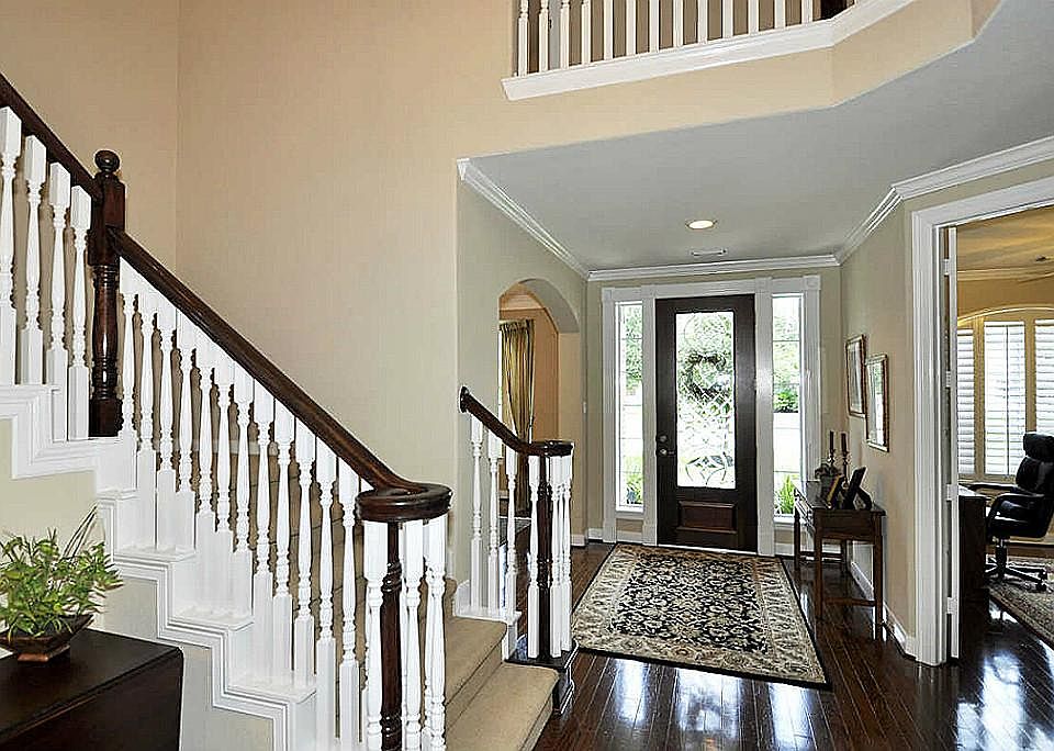 Extraordinary foyer with etched glass front door. All tile & rich wood floors downstairs except master bedroom & bonus room. New A/C unit installed upstairs in June, 2013.