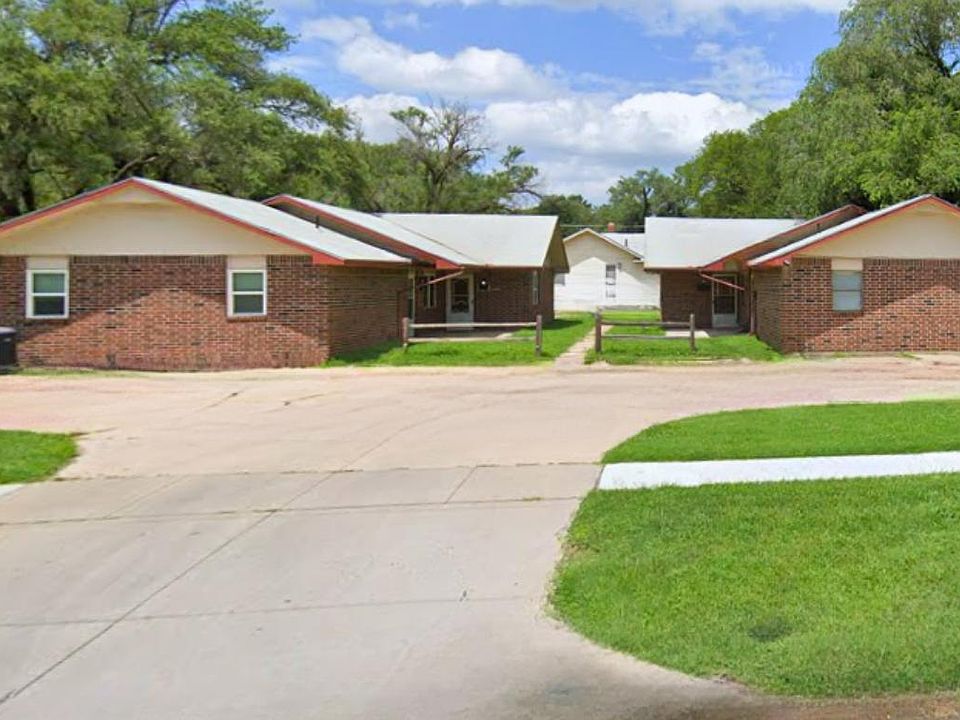 Welcome to our charming brick duplex, featuring ample parking for your convenience and comfort.