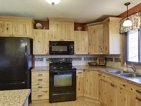 Remodeled kitchen with custom hickory cabinetry