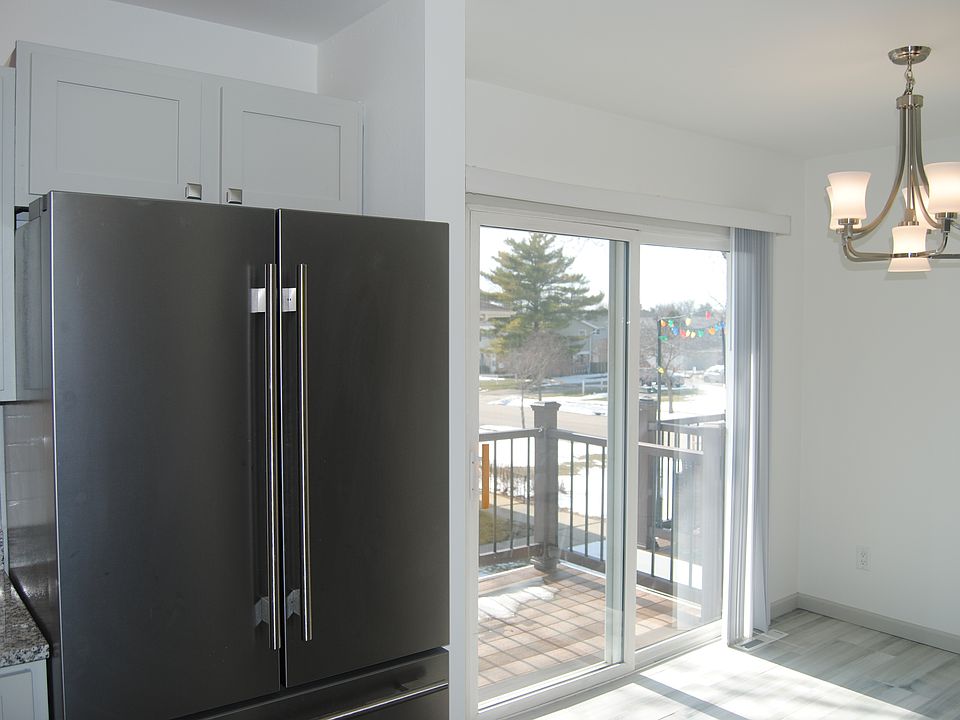 Kitchen dining area with sliding door leads to new balcony