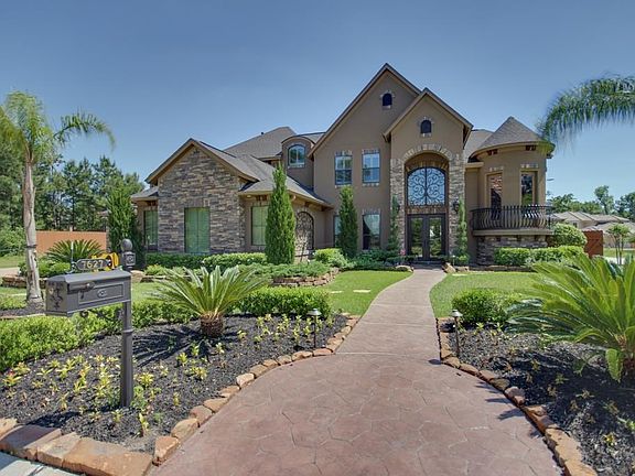 Front view with lush landscaping