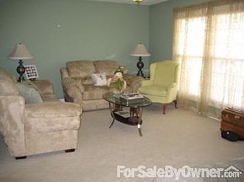 Living room
						:
						Living room is carpeted; has tons of natural light. (previous arrangement shown)
