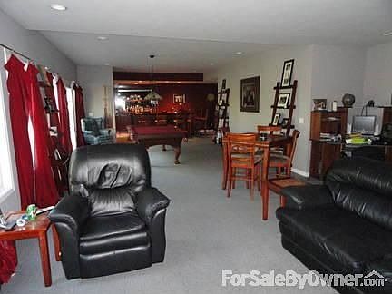 Lower Level Family Room & Bar : Beautiful custom-built bar, pool table, entertainment area