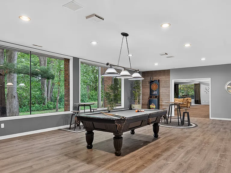 Game room with billiards at Eastwood Village Apartments in Clinton Township, MI.