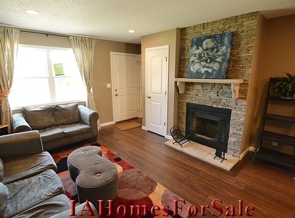 Living Room with stone wood burning fireplace