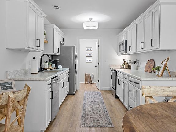 Unit is being rented unfurnished. This photo is the unit next door and for illustrative purposes only.