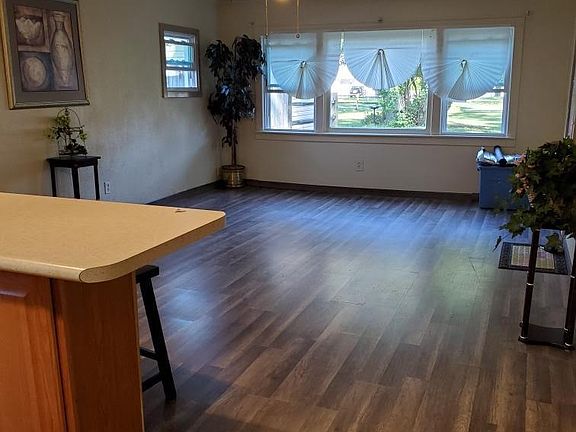 Open concept Home with new floors, energy windows, oval glass doors, furnace, water heater and bath room
