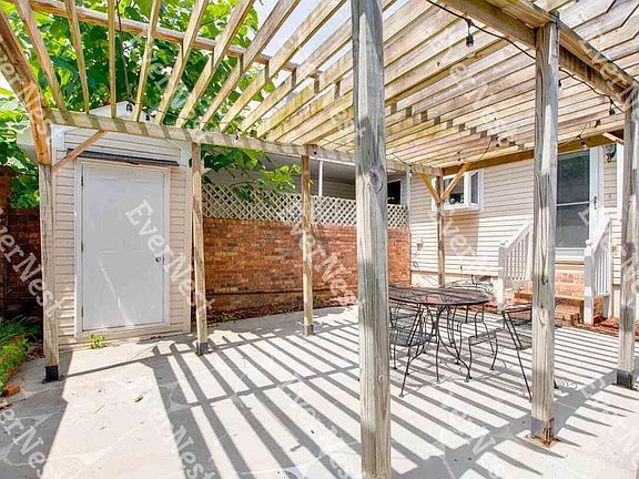 Pergola over lanai and separate storage unit