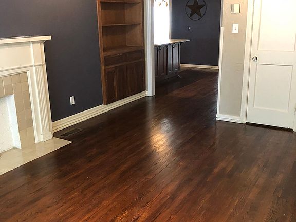 Entry/living area in the front of the house. Beautiful wood floors.