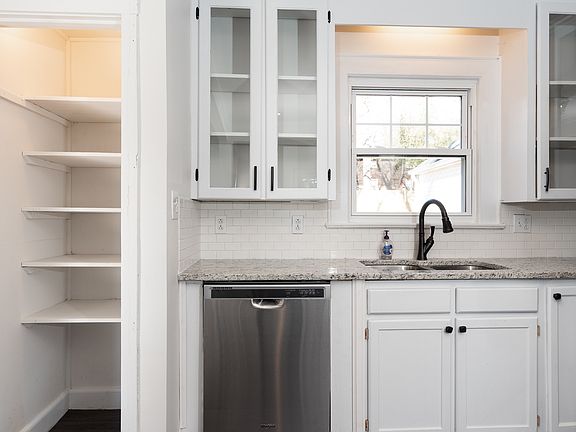 Kitchen has Pantry closet, stainless appliances, granite counters