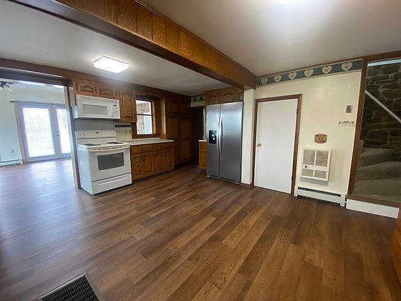 Plenty of space to move around in this kitchen. New flooring.