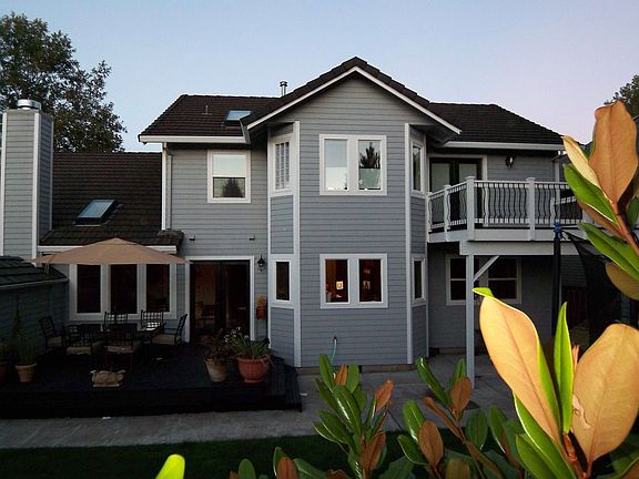 back yard offers two decks and flat yard beautifully landscaped