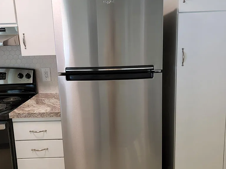 New Whirlpool refrigerator and plenty of storage.
