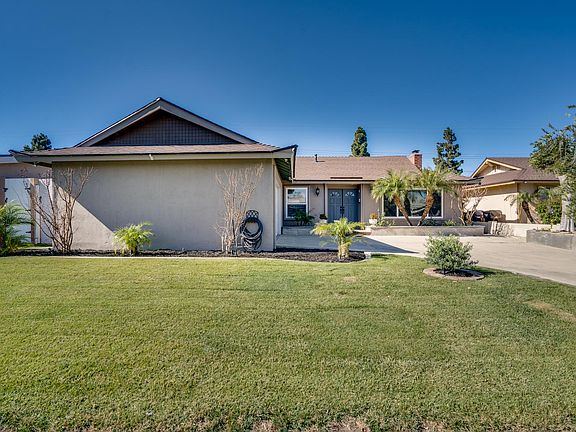 Large grass area in front of house.