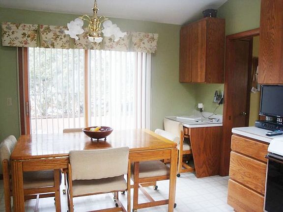 Another view of kitchen eating area and here you can see a small desk area.
