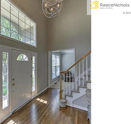 Soaring Ceilings in Foyer, Refinished Dark Hardwoods & Designer Stair Carpet!