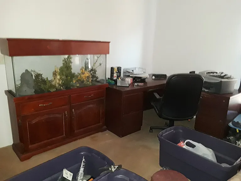 100 Gallon Fish Tank Missing Inhabitants. Has most everything to use. currently Located in Living Room.

Desk For Office in Master Bed Room,