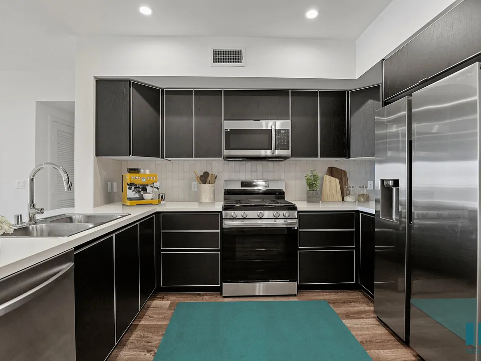 Kitchen with Stainless-Steel Refrigerator, Stove, Microwave Oven, and Dishwasher
